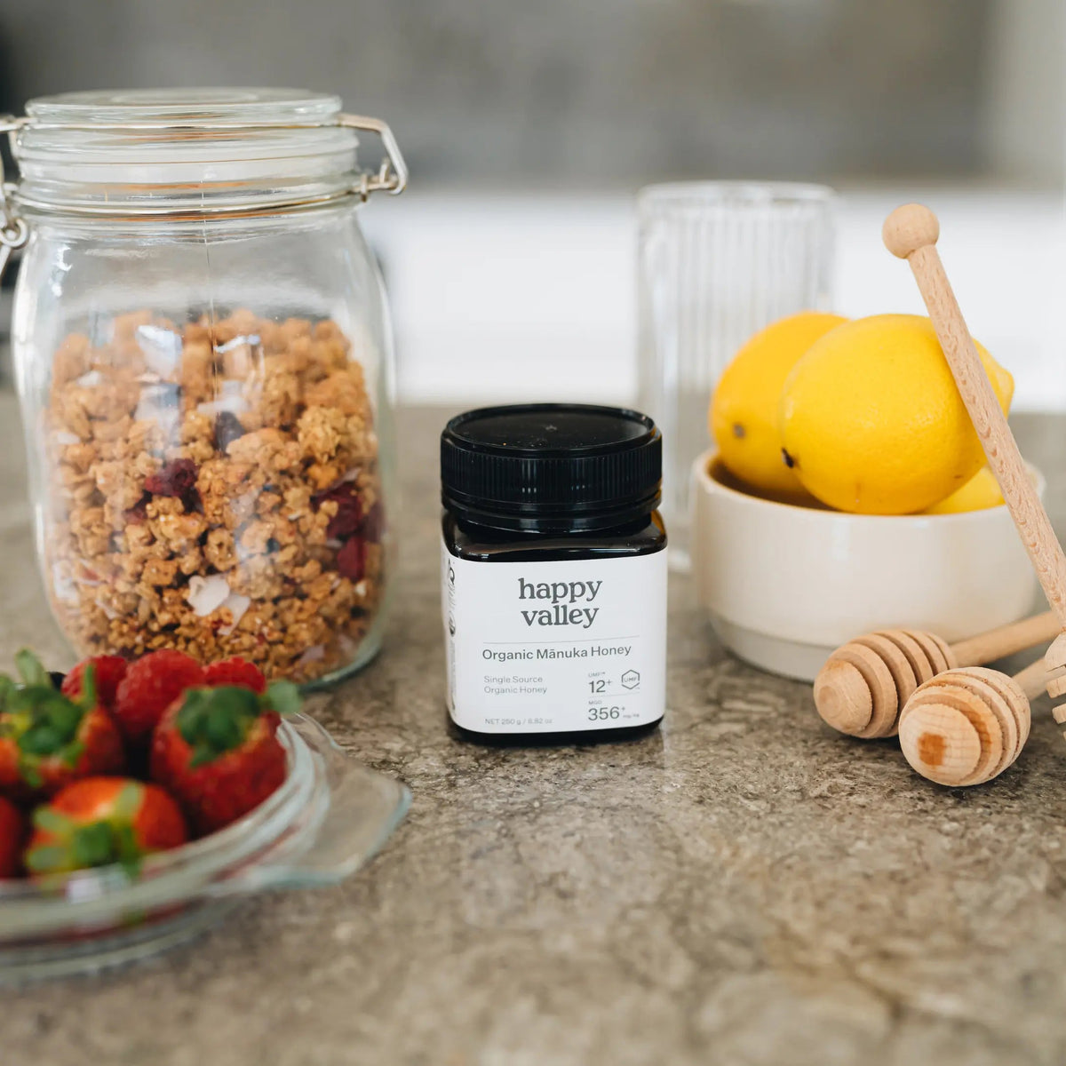 Happy Valley Organic Mānuka Honey jar with fruit and granola