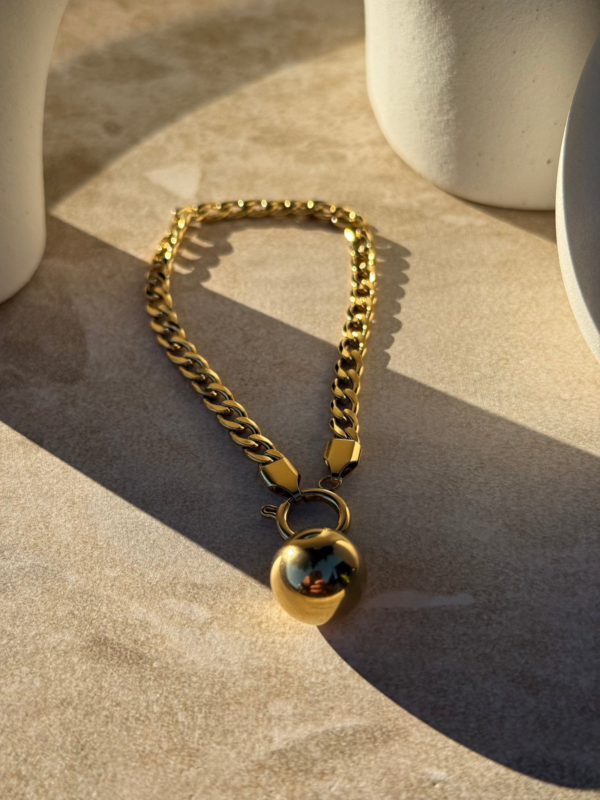 Pōro Toa Gold Bracelet in sunlight