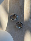 Tāwhirowhiro Silver Twisted Hoop Earrings in sunlight