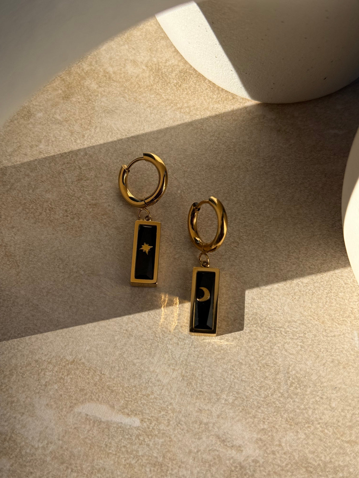 Whetū & Marama Pango Gold Huggies close-up