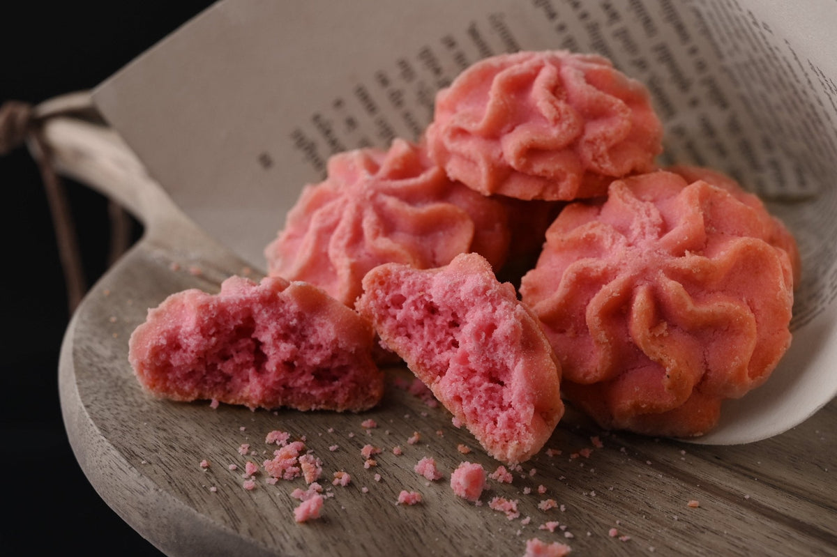 Lowrey Raspberry butter cookies, one broken in half