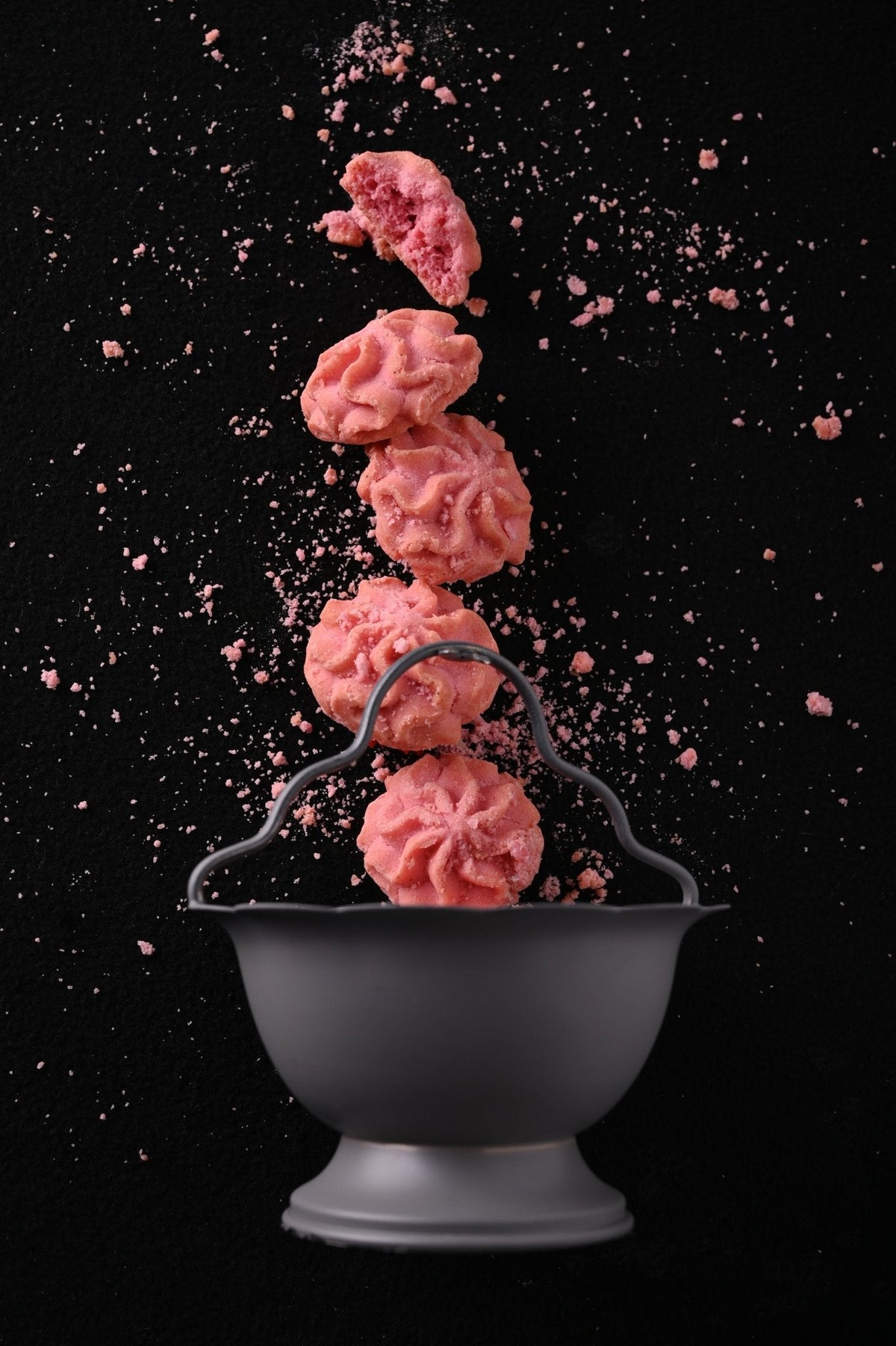 Stack of Lowrey Raspberry butter cookies above a bowl
