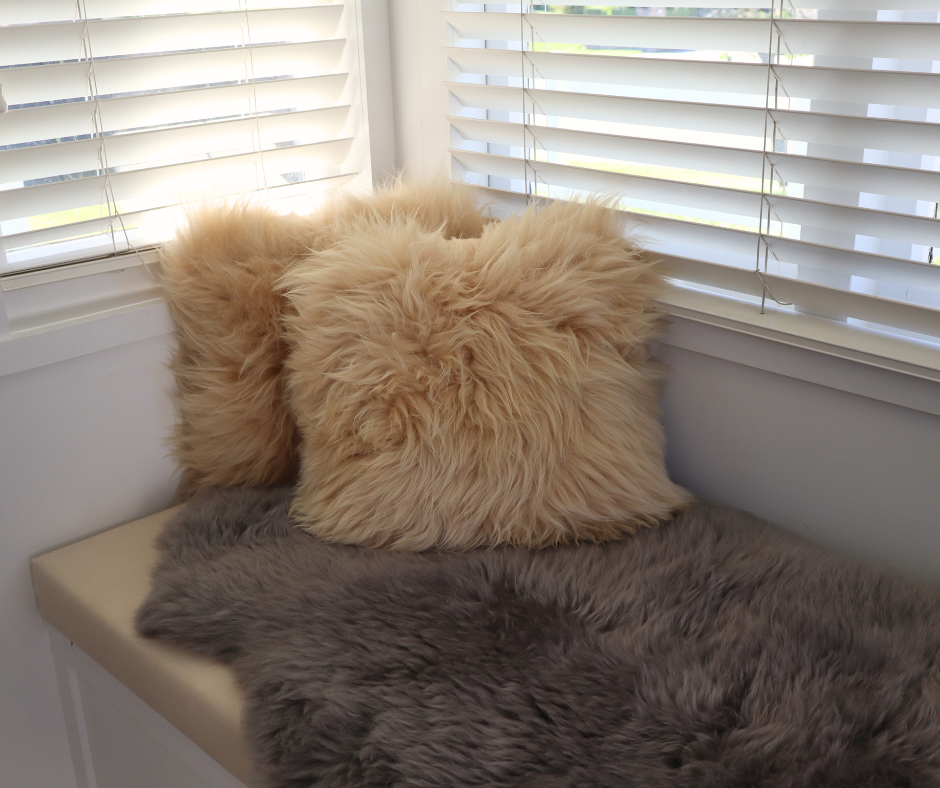 Honey double-sided sheepskin cushion on a window seat