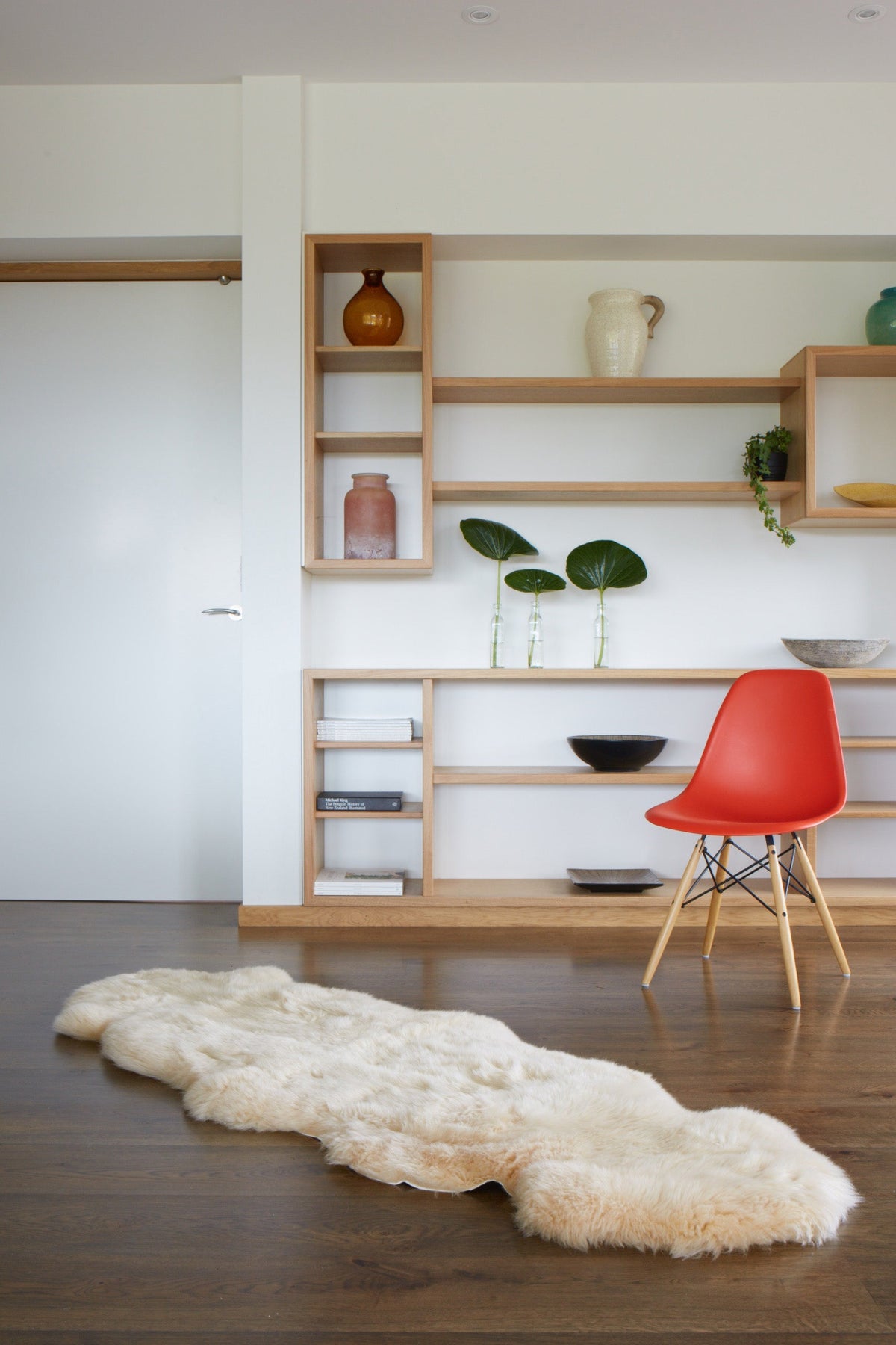 Sand double sheepskin rug on a wooden floor