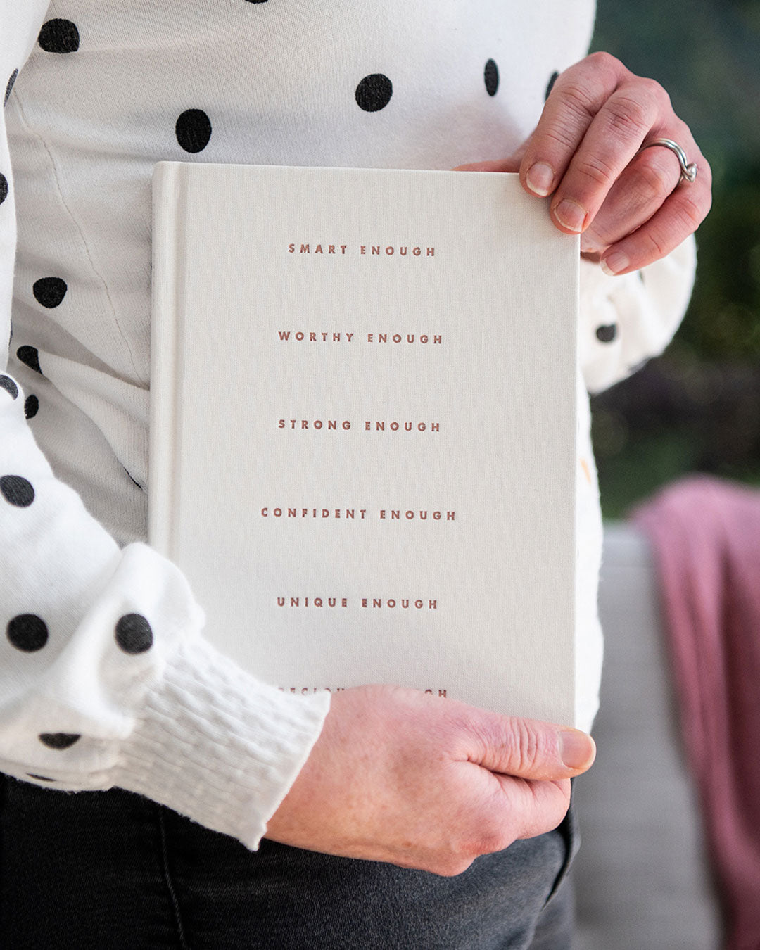 Person holding a cream I Am... Mindset Journal