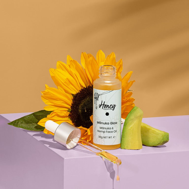 The Honey Collection face oil bottle with a sunflower