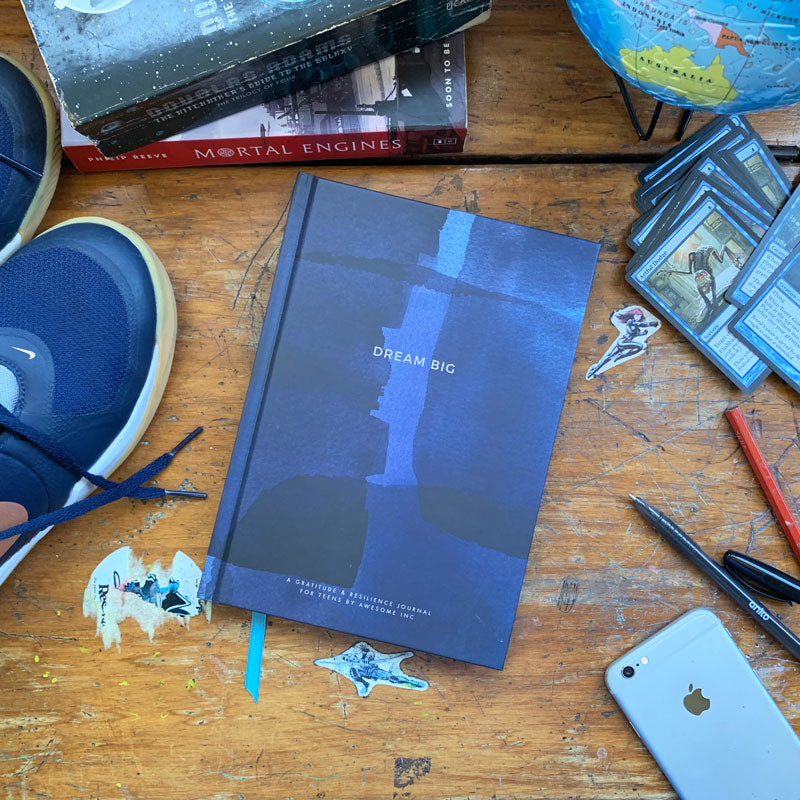 Blue Resilient ME teen journal on a desk