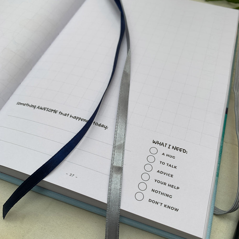 Inside pages of the You + ME Connection Journal with ribbon