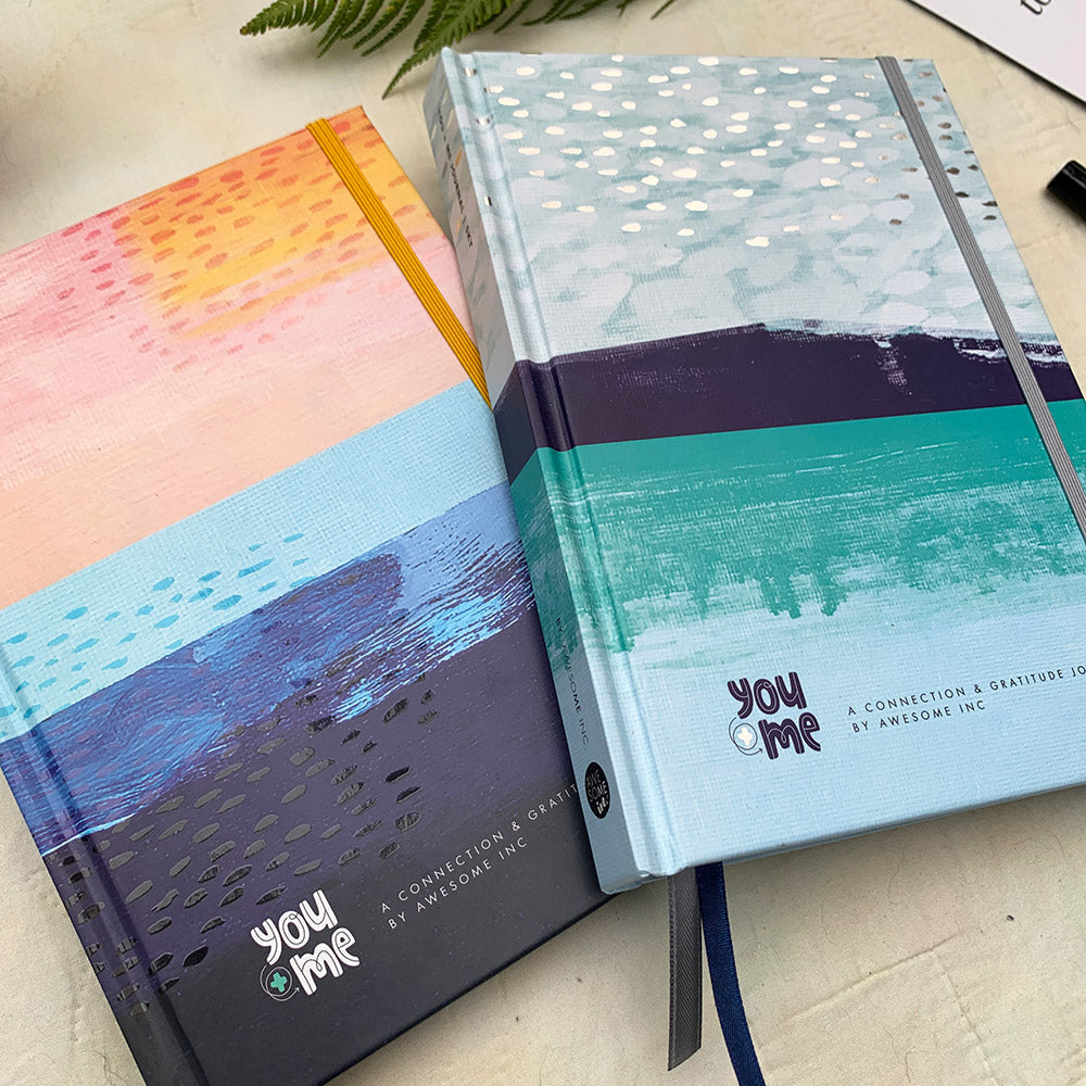 You + ME Connection Journals in Ocean and Sky covers on a table
