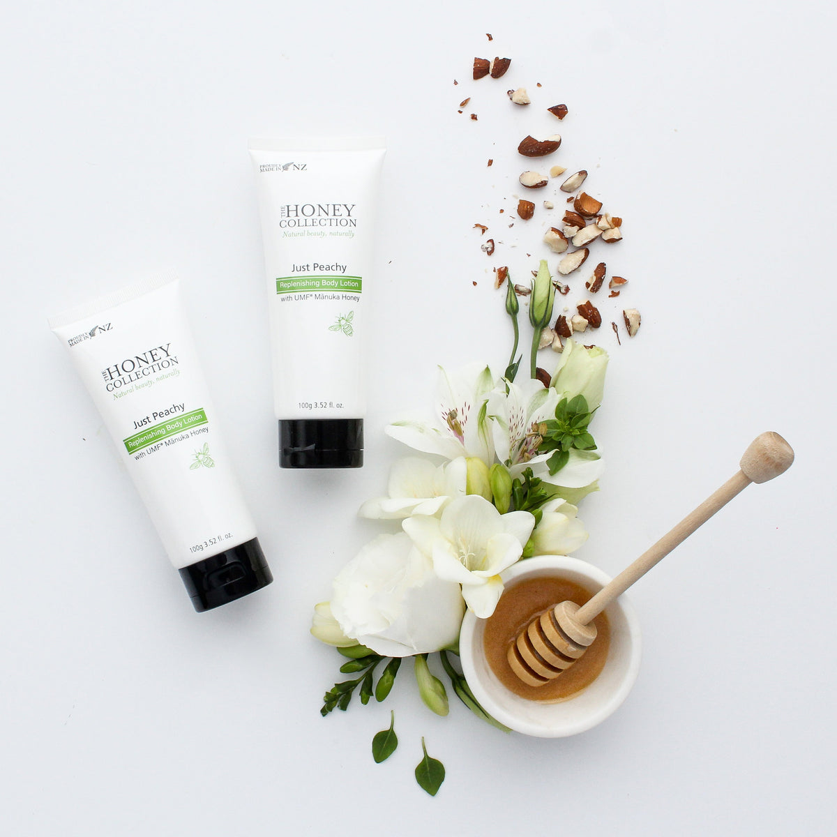 Just Peachy Body Lotion tubes with flowers and a honey dipper