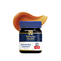Manuka Health Original Manuka Honey MGO 573+ jar with a swirl of honey