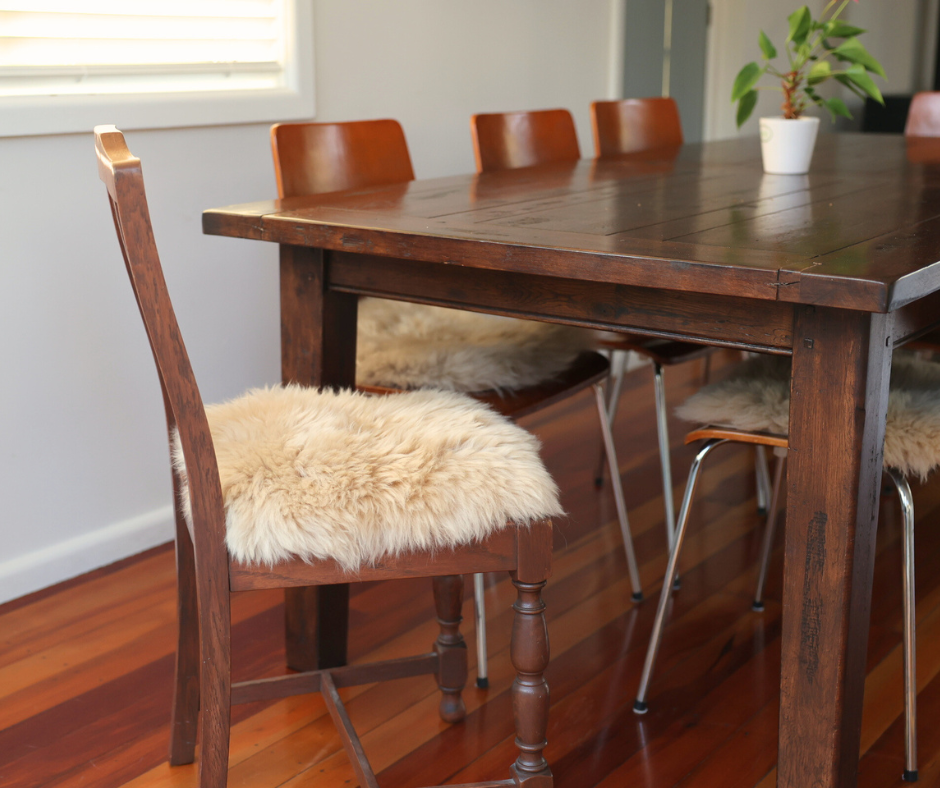 Honey sheepskin seat pad on a wooden dining chair
