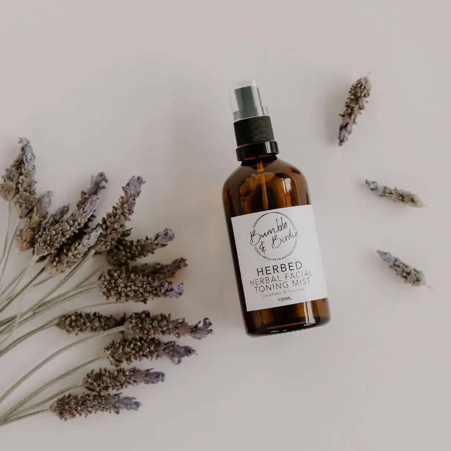 Herbed facial toning mist bottle by Bumble & Birdie with sprigs of dried lavender