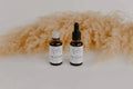 Two Bumble & Birdie face oil bottles for the Powerhouse Ritual Set, with pampas grass
