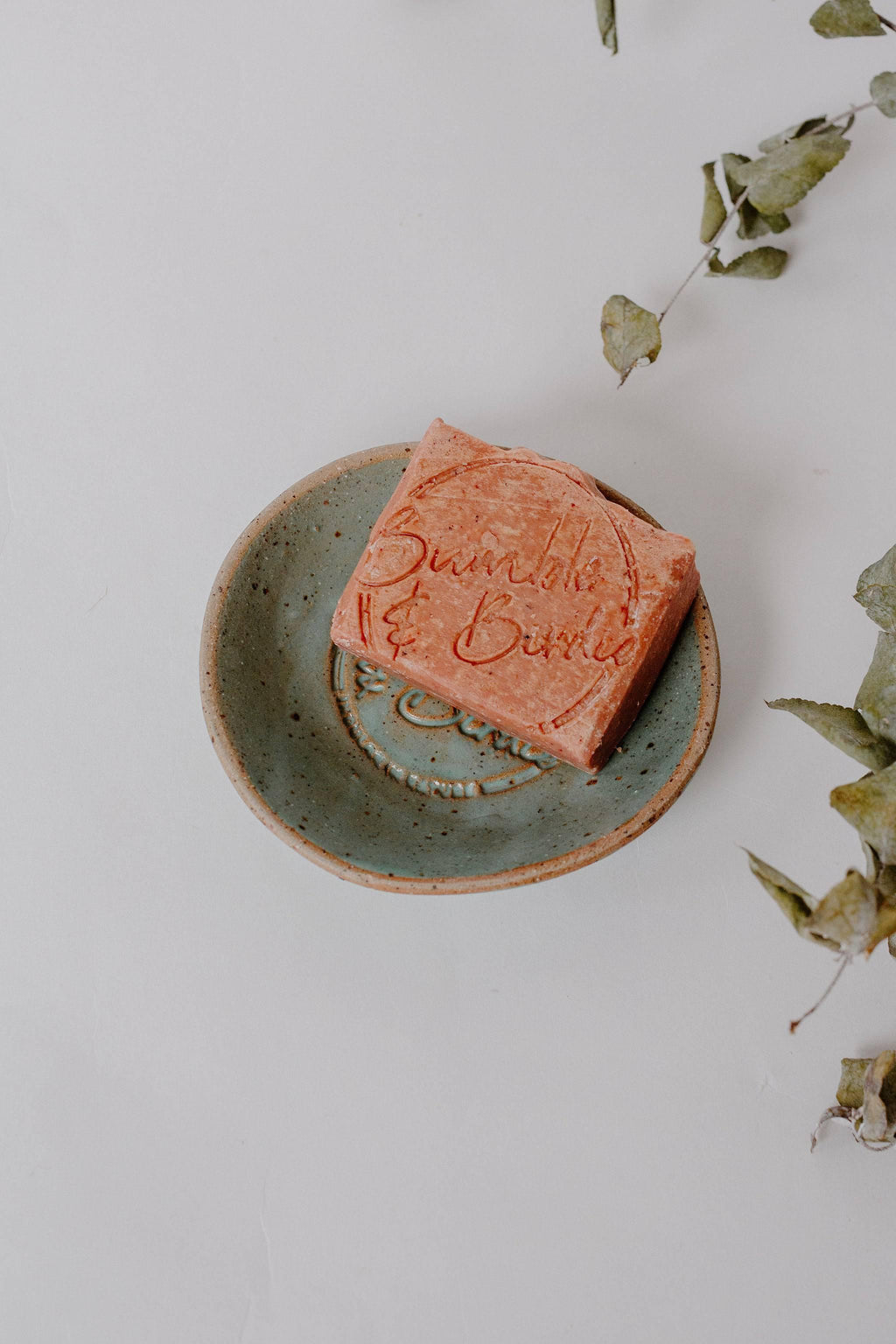 Bumble & Birdie body bar on a green pottery soap dish from the Earth Cleanse Gift Set