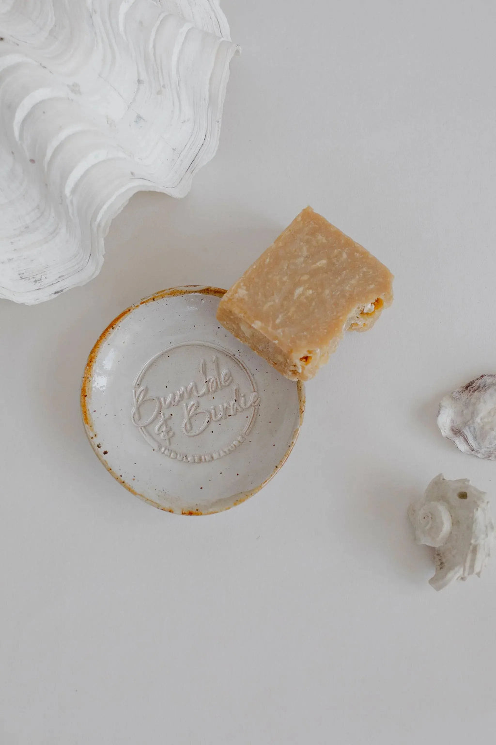 Earth Soap Sanctuary soap dish holding a Bumble & Birdie body bar