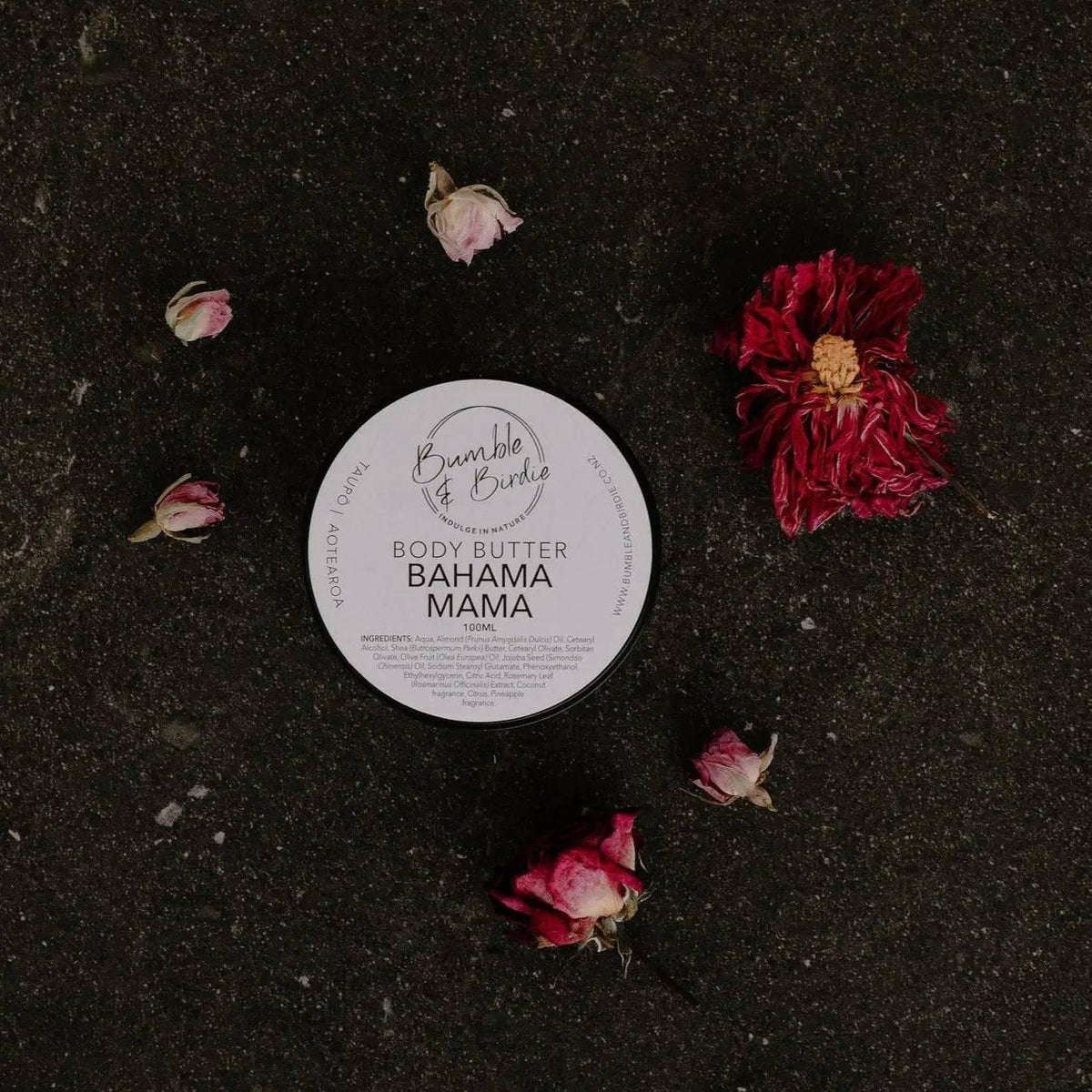Tin of Bahama Mama body butter by Bumble & Birdie from above, with dried flowers
