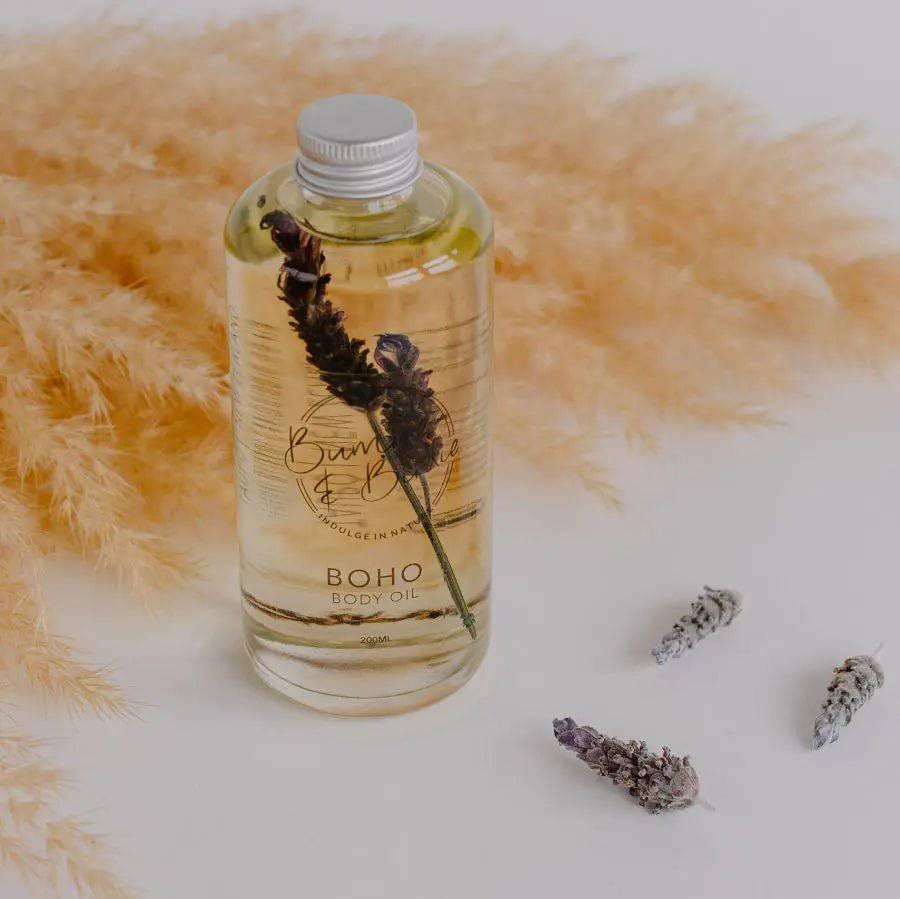 Boho body and bath oil in a clear bottle with a lavender sprig inside, by Bumble & Birdie