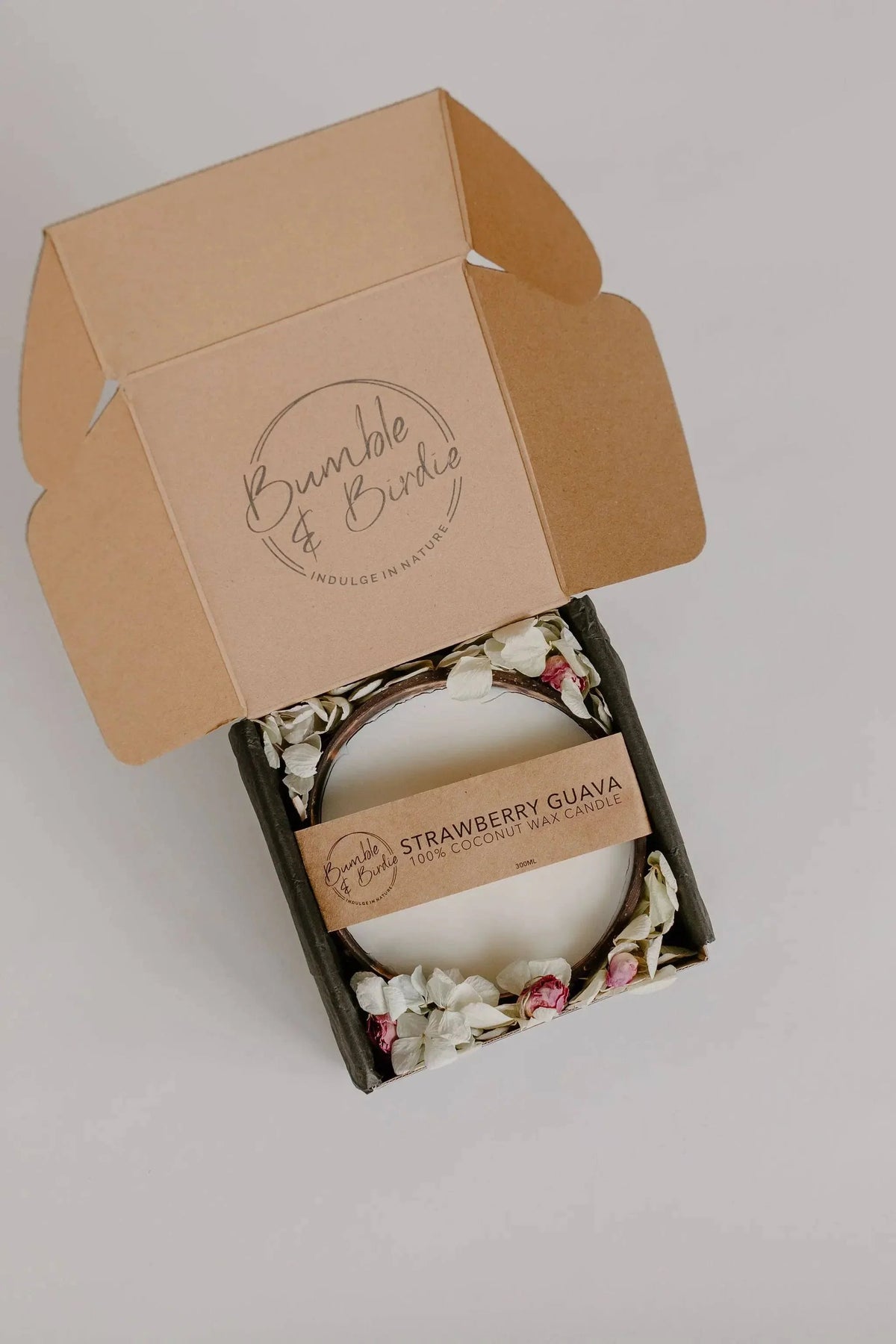Strawberry Guava coconut candle in an open kraft Bumble & Birdie gift box