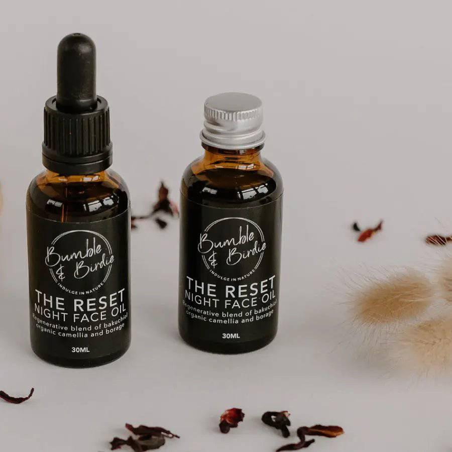 The Reset night face oil in a dropper bottle and a refill bottle by Bumble & Birdie