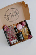 Lovers Lane Gift Set in an open Bumble & Birdie box with a jar candle, body oil, bath bomb and chocolate