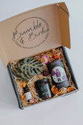 Sweet Nothings Gift Set in an open Bumble & Birdie box with a jar candle, essential oil, tea and leaf coasters