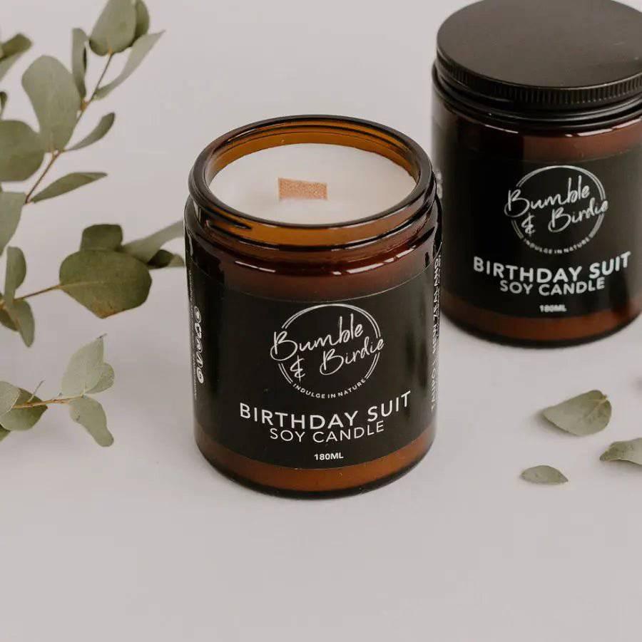 Birthday Suit soy candle in an amber glass jar by Bumble & Birdie, with eucalyptus
