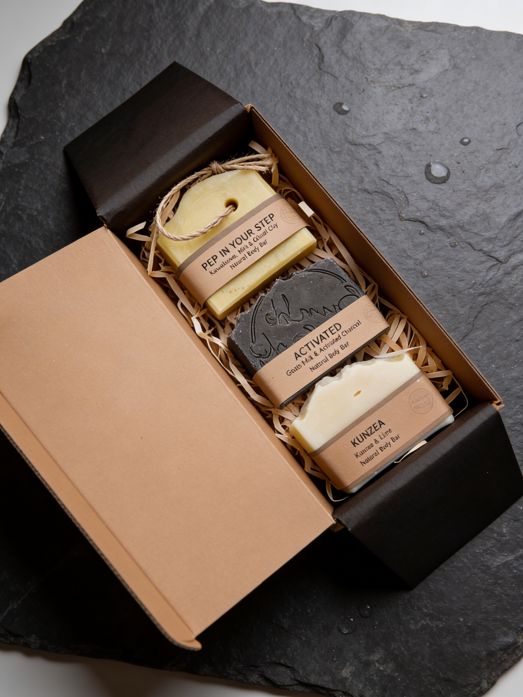 Three's Company Soap Set: three Bumble & Birdie body bars in an open box on slate