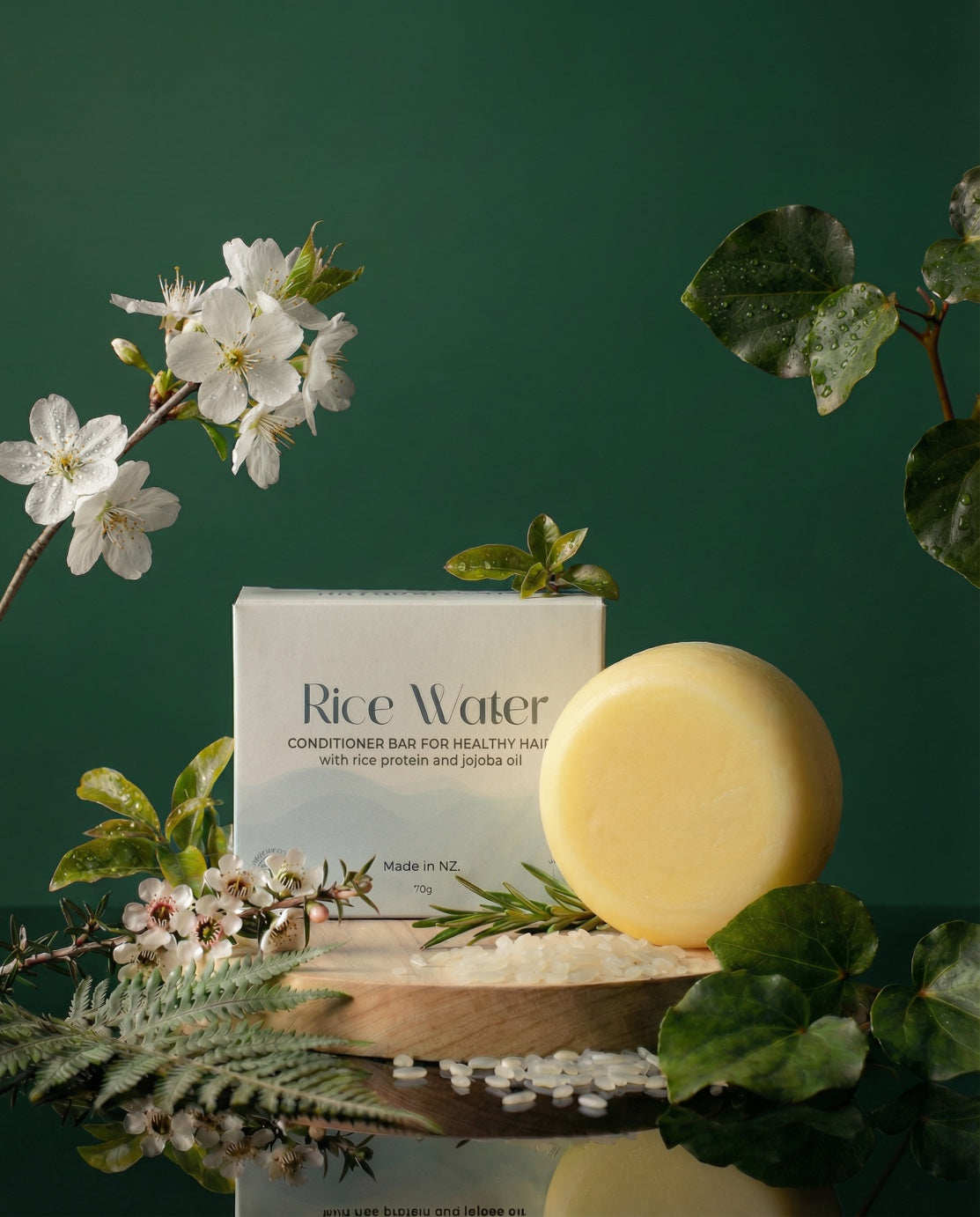 NaturalCare Rice Water bar and box with white flowers, close view