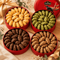 Four open Lowrey tins of Original, Matcha, Chocolate and Coffee butter cookies