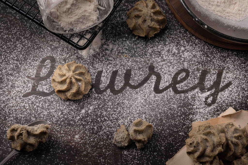 Lowrey Black Sesame butter cookies on dark sesame-dusted surface