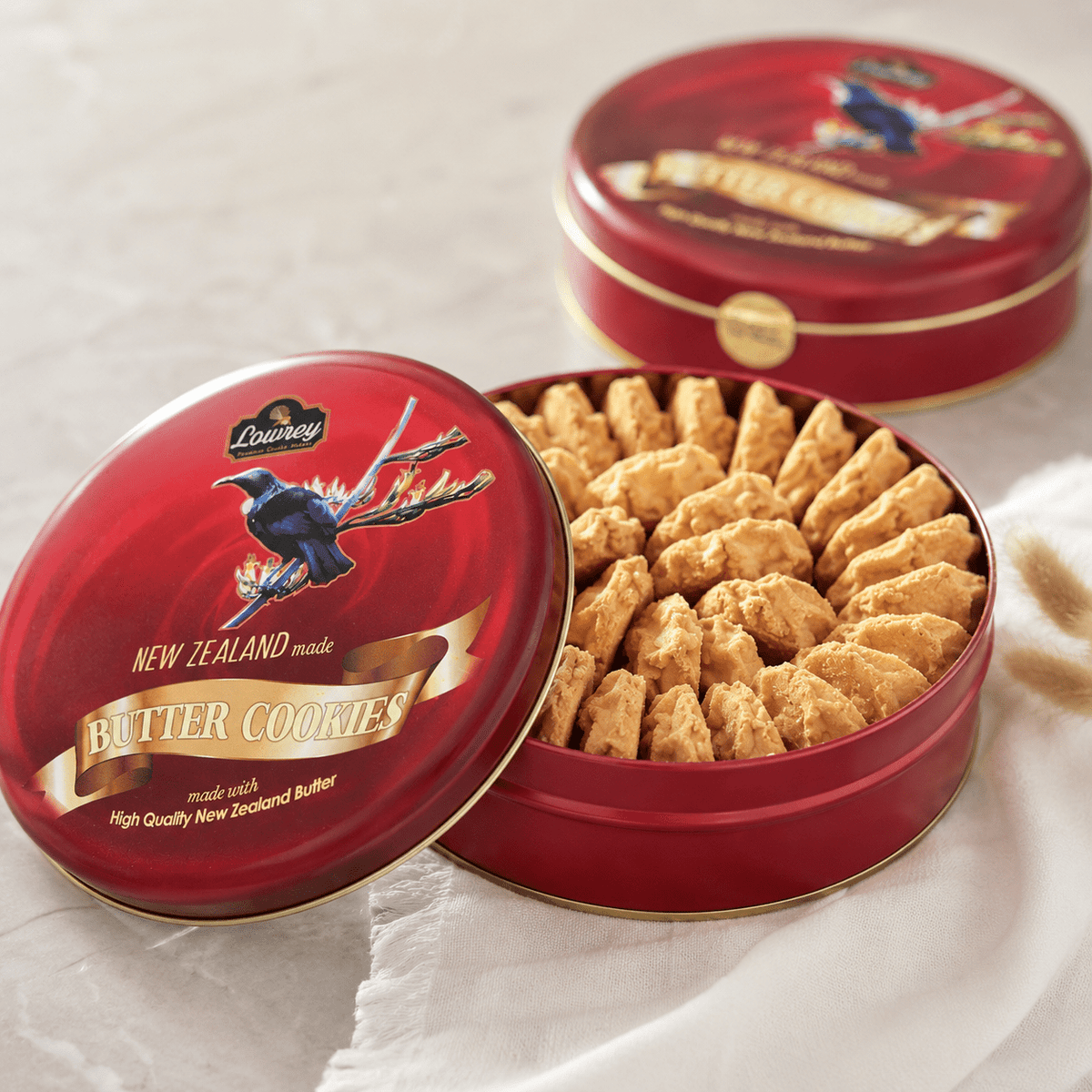 Open red tin of Lowrey Original butter cookies