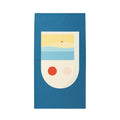 Blue Frankly Cotton lightweight towel with an abstract beach print, laid flat