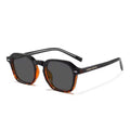 URBA VISTA Henry sunglasses with a black and tortoiseshell frame and dark lenses, angled view