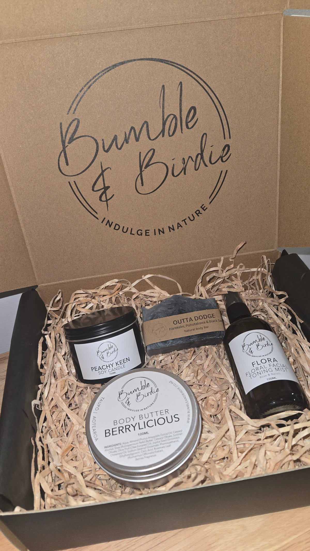 Berrylicious Gift Set in an open Bumble & Birdie box with body butter, tin candle, body bar and facial mist