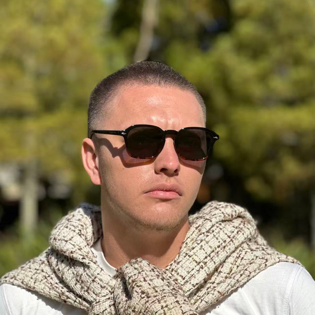 Man wearing dark URBA VISTA sunglasses outdoors