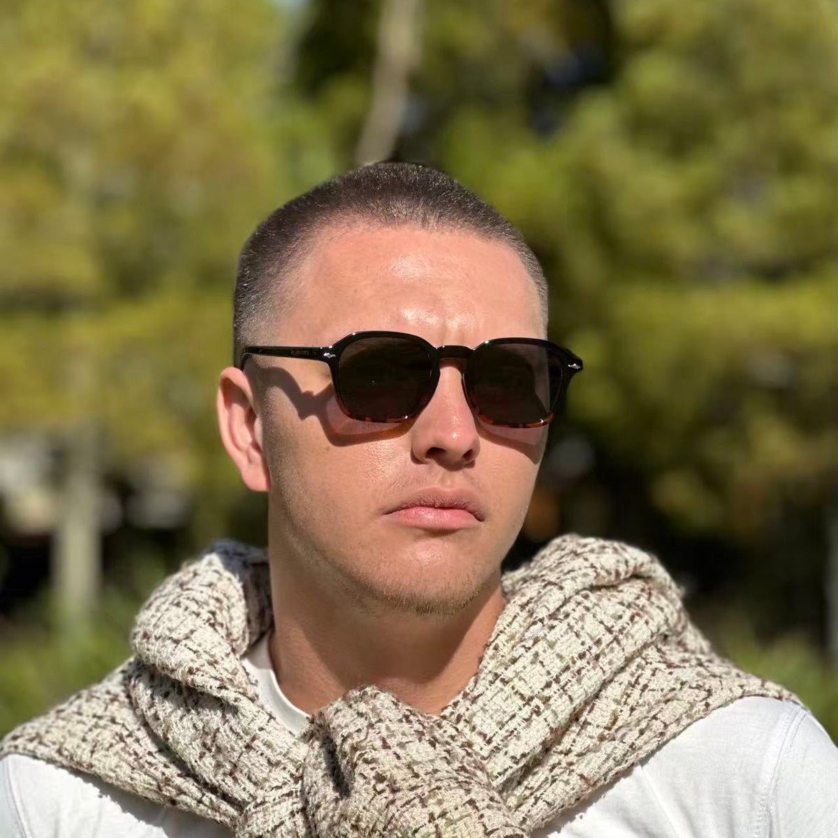 Man wearing dark URBA VISTA sunglasses outdoors