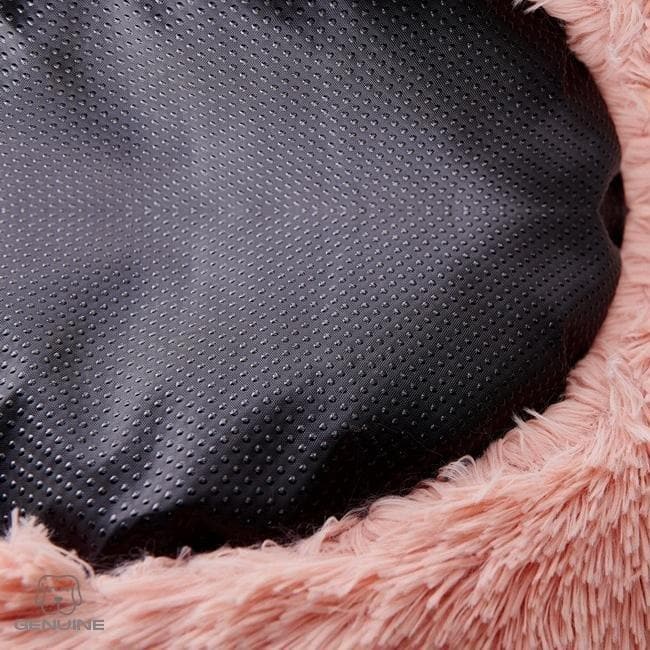 Close-up of the black base under a pink plush Brooklyn cat bed